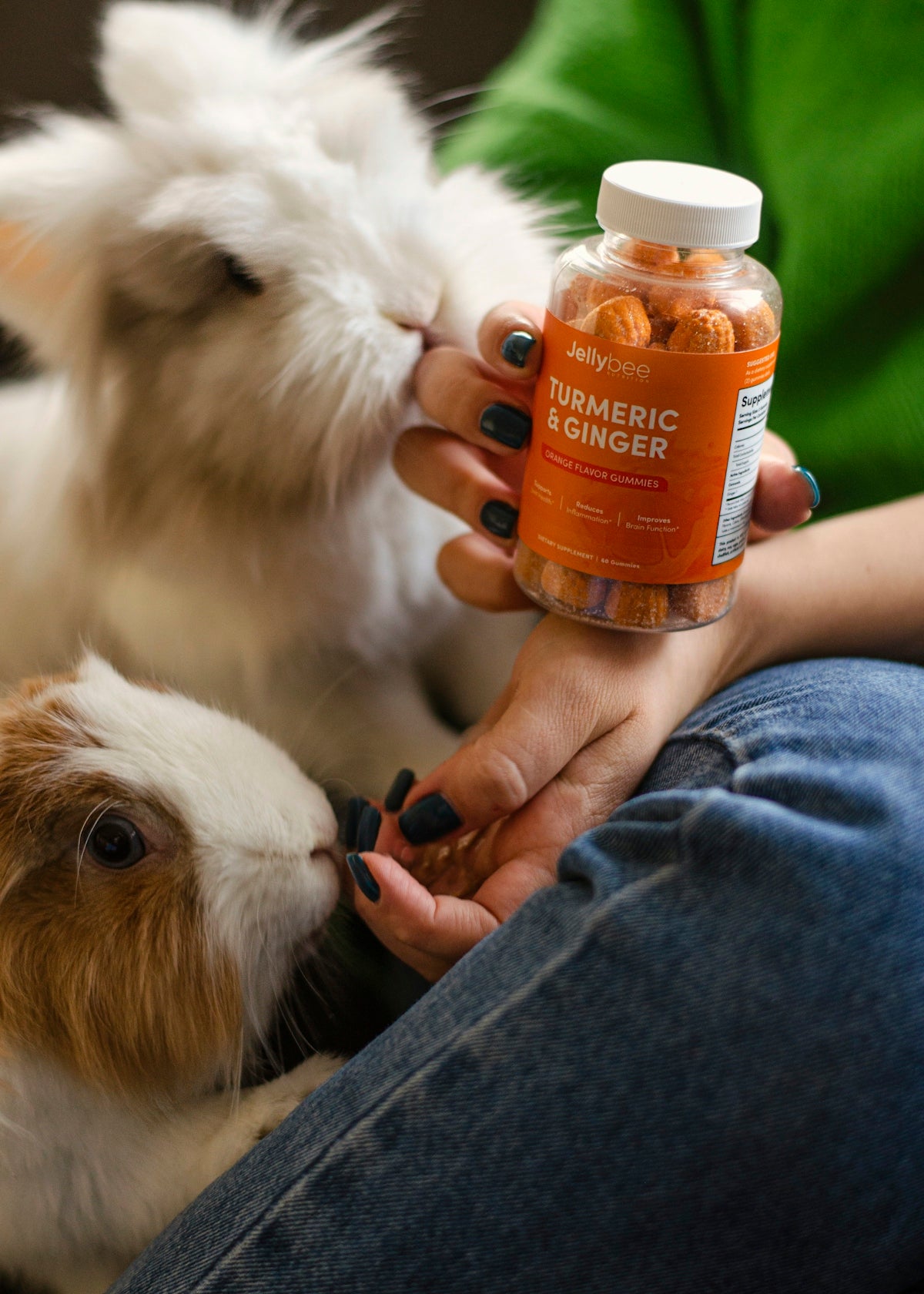 person holding orange plastic bottle