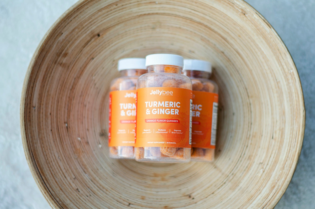 orange and white plastic bottles on brown wooden round plate