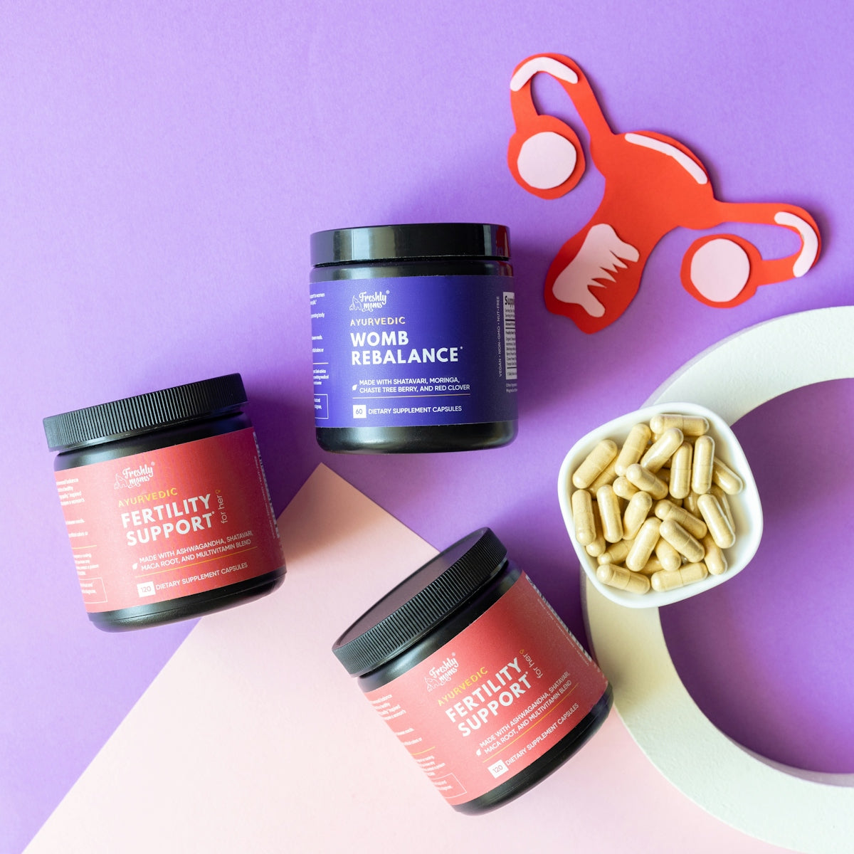 three jars of vitamins, a spoon, and a pair of scissors on a
